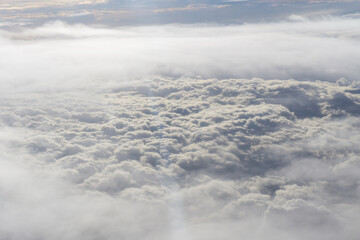 Aerial view of clouds in the sky. View from airplane window