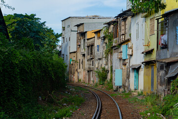 Street - railway.  A small street in Nha Trang in Vietnam with railway tracks running through the residential sector.