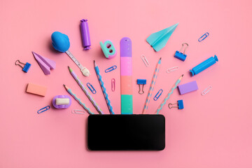 Stationery on a pink background. Bright stationery in pastel colors for schoolchildren. Hello...