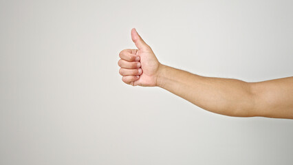 Young hispanic man with thumb up gesture over isolated white background