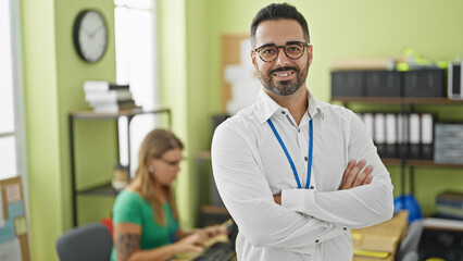 Man and woman business workers working standing with arms crossed gesture at office