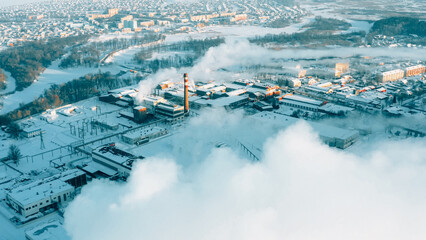 Aerial View Of Old Paper Mill Factory. Bird's-eye View At Sunny Snowy Winter Day . Plant Pipe With Escaping Steam Or Smoke. - obrazy, fototapety, plakaty