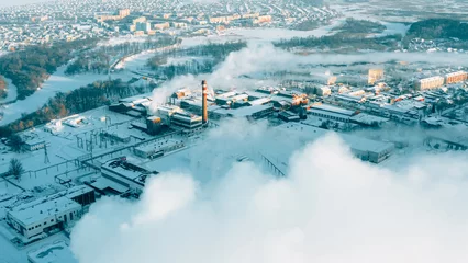 Foto op Aluminium Aerial View Of Old Paper Mill Factory. Bird's-eye View At Sunny Snowy Winter Day . Plant Pipe With Escaping Steam Or Smoke. © Grigory Bruev