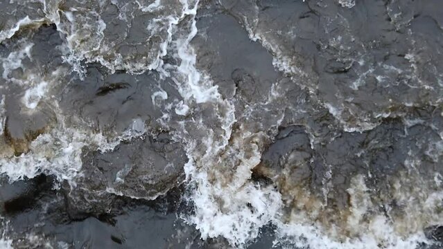 Swirling dark water from above, slow motion