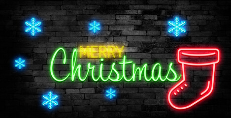 Merry Christmas shiny neon lamps sign glow on black brick wall. colorful sign board with text Merry Christmas and Christmas tree for party decoration.