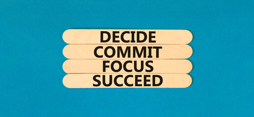 Decide commit focus succeed symbol. Concept word Decide Commit Focus Succeed on beautiful wooden...