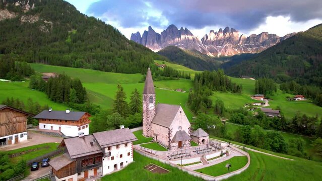 Stunning Alpine scenery of breathtaking Dolomites rocks mountains in Italian Alps, South Tyrol Alto adige , Italy. Aerial view of Val di Funes and village Santa Maddalena