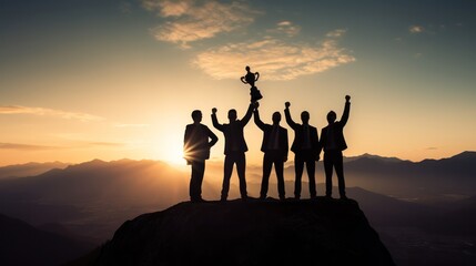 Silhouette group of businessman holding a trophy on top of a mountain, Business and success concept