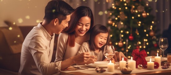 Obraz na płótnie Canvas Asian Family celebrating christmas new year and. Home holiday and Christmas tree
