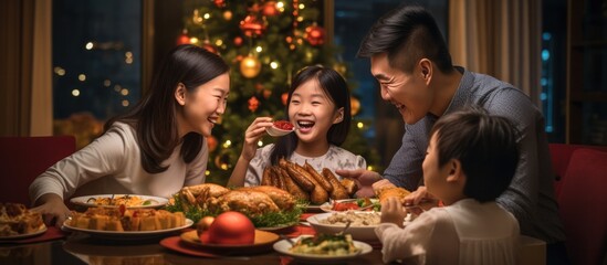 Asian Family celebrating christmas new year and. Home holiday and Christmas tree