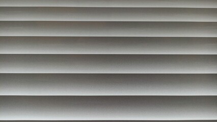Window blinds with wavy gray striped