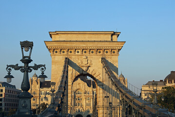 Chain Bridge that spans the River Danube between Buda and Pest In Budapest Hungary at sunset