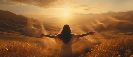 The Serene Embrace of Nature: A Woman Finding Solace in a Vast Field. A woman standing in a field with her arms outstretched as the sun goes down.