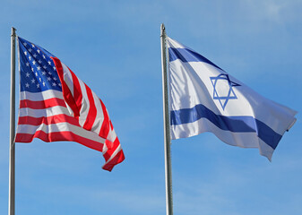 American and Israeli flags waving in the wind together in the sky