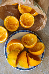 Oranges being squeezed for fresh orange juice