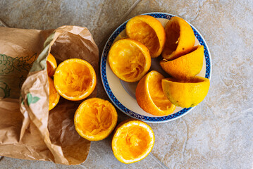 Oranges being squeezed for fresh orange juice