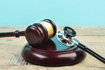 Judge gavel and stethoscope. The law in medicine, the sentence on medical negligence.