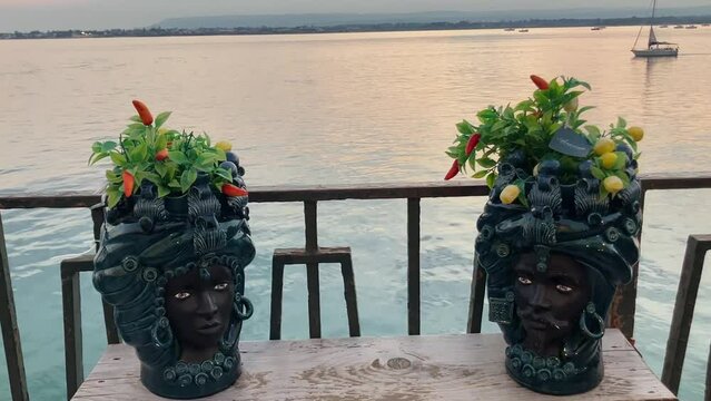 Sicilian Moorish Ceramic Heads vases art of Maiolica. Testa di Moro typical of caltagirone in the Souvenirs shop in Sicily. Siracusa 