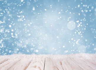 Christmas background with white wooden desk, covered by snow
