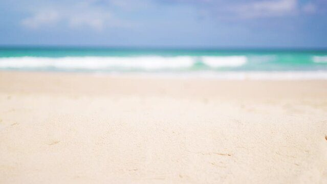 Close-up focused sandy beach blurred sky. Tropical white sandy desert beach clean. summer background. Text Space area.