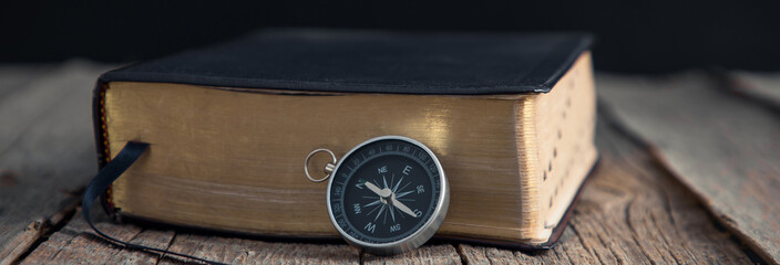 compass with Holy Bible © Daniel