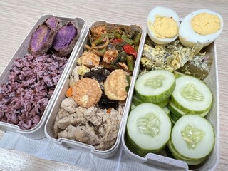 Stir-fried chicken with spicy tofu, boiled eggs, brown rice and baked purple potatoes