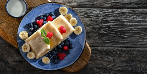 A plate of pancakes filled with sweet cottage cheese