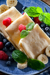 A plate of pancakes filled with sweet cottage cheese