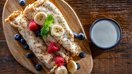 A plate of pancakes filled with sweet cottage cheese