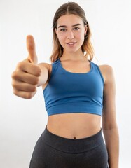 Portrait of a good-looking girl showing thumb up