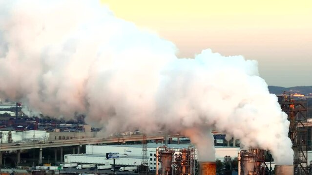 Clouds of industry. 4k aerial drone video of flue gas smoke from industrial plant