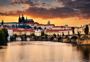 Obraz premium Historic Prague Castle at sunset with Vltava River in the backdrop. 