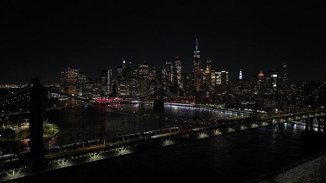 Aerial night establishing New York Bridges river skyscrapers 4k