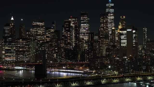 4k night aerial stock footage New York 2023. View of bridges and buildings.
