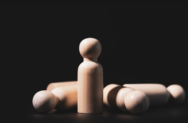 Wooden mannequin laying and sleeping with copy space, black background, business leader concept.