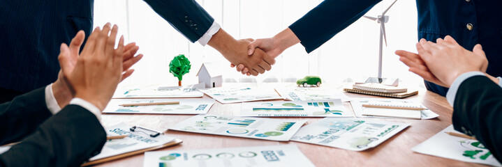 Business people hand shake in Eco corporate meeting room after made successful agreement deal on...