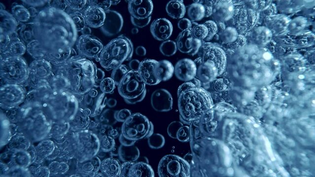 Super Slow Motion of Bubbling Blue Water in Detail. Extreme Macro Shot, Abstract Texture. Filmed on High Speed Cinema Camera, 1000 fps.