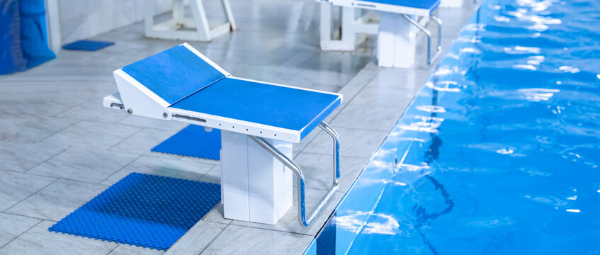 blue starting block in the swimming pool, sport swim olympic kind of sport