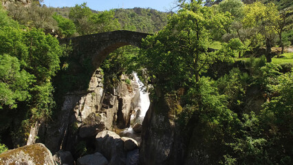 Aerial Shot of Stunning Nature Landscape in Portugal. Waterfall in the Mountains. Misarela Bridge 