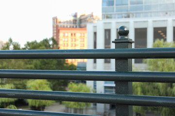 metal fence in golden sunset light, offering security and charm to a countryside landscape