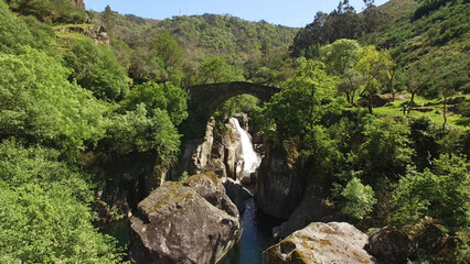 Aerial Shot of Stunning Nature Landscape in Portugal. Waterfall in the Mountains. Misarela Bridge 