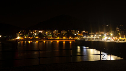 Fototapeta na wymiar Lekeitio town night view from pier, Spain