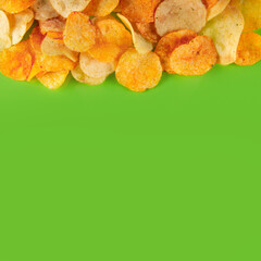 Border of potato chips isolated on light green background. Zesty and flavorful munchie for any occasion