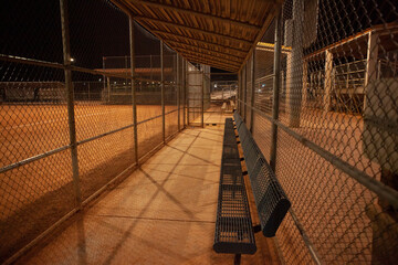 Empty dugout at night, baseball field - obrazy, fototapety, plakaty