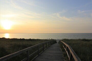 Fototapeta na wymiar Wooden boardwalk to the Baltic Sea beach.