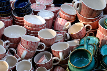 Handmade crockery and serve wares on the sale in the Pune, India, street market. Beautiful ceramic...