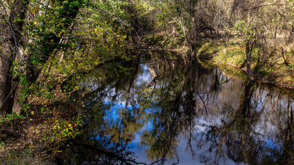 Scenic view of Calumet Creek near Clarksville, Missouri with surrounding landscape reflected in its waters