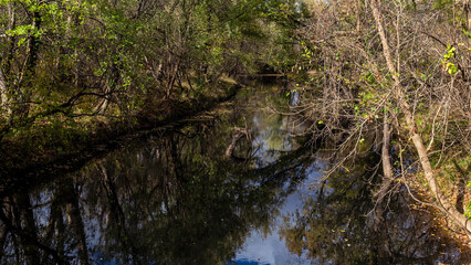 An abandoned derelict gas station with one broken pump