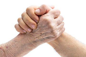 Arm wrestling concept of old hand vs young isolated on white