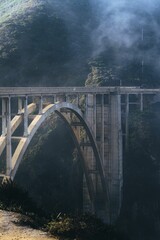 Majestic, fog-shrouded Bixby Creek Bridge arcs across the breathtaking mountainscape